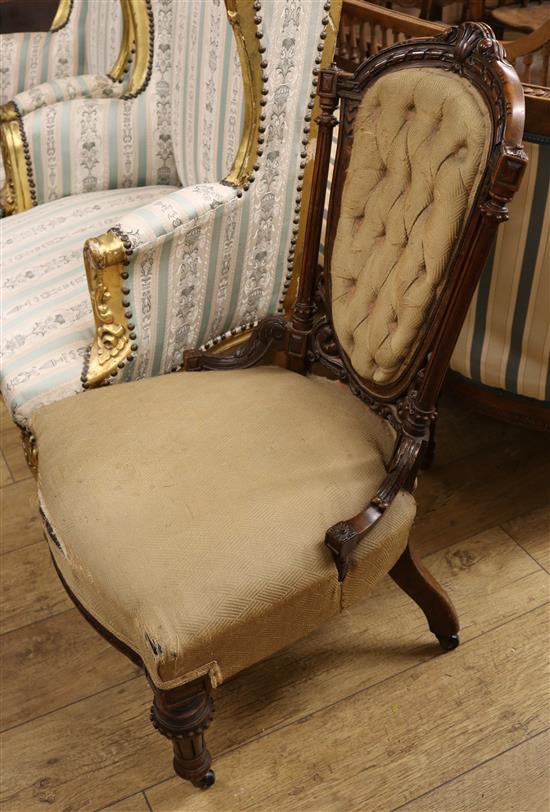 A Victorian walnut button back nursing chair